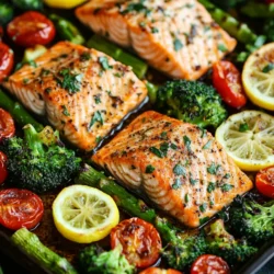 If you're looking for a delicious and effortless dinner option, look no further than Sheet Pan Garlic Butter Salmon and Veggies. This dish beautifully combines flaky salmon with a medley of vibrant vegetables, all enveloped in a rich garlic butter sauce that elevates the flavors to new heights. Not only is this recipe a feast for the eyes, but it is also a delight for the palate, making it a perfect choice for both busy weeknights and special occasions.