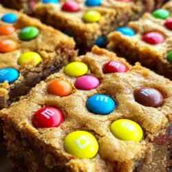 In the world of desserts, cookie bars have emerged as a beloved favorite, captivating the hearts of both children and adults alike. These delightful treats combine the best features of cookies and brownies, offering a soft, chewy texture that’s easy to cut into squares. Whether you’re hosting a party, looking for a fun activity with the kids, or simply craving something sweet, M&M's Cookie Bars are the perfect solution. Not only are they visually appealing with their vibrant colors, but they also promise a delicious taste that keeps everyone coming back for more.